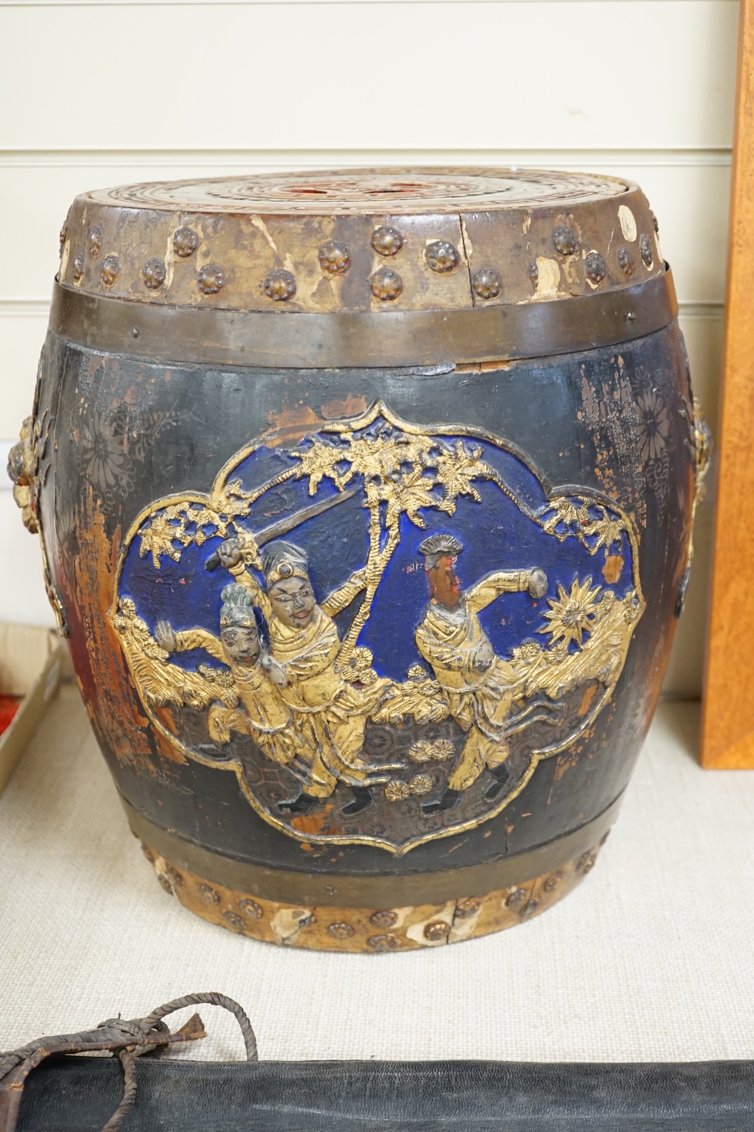 A Chinese lacquer decorated wood barrel form seat/storage container, 40cms high